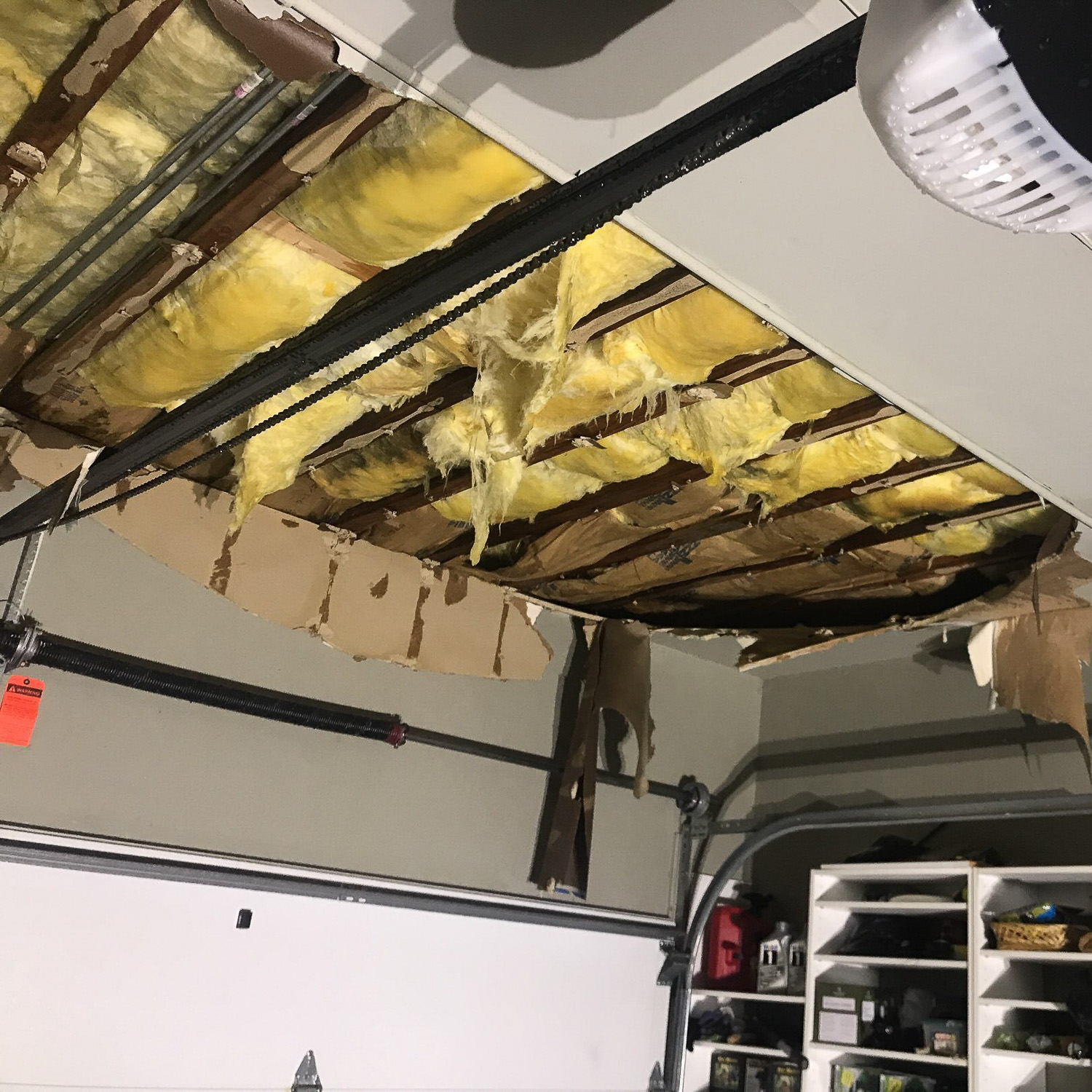 water damaged garage ceiling before water damage restoration